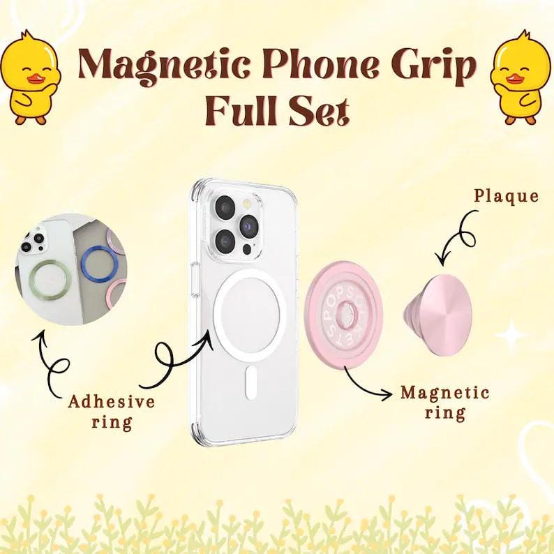 May include: A full set of magnetic phone grip accessories, including an adhesive ring, a clear phone case with a magnetic ring, a pink magnetic ring, and a pink plaque. The text "Magnetic Phone Grip Full Set" is displayed at the top.