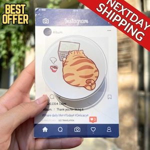 May include: A rectangular sticker featuring an Instagram-themed design. The sticker includes a cartoon cat working on a laptop, a coffee cup, and the text "Album. Thank you for liking it." The sticker also has the text "BEST OFFER" and "NEXTDAY SHIPPING".