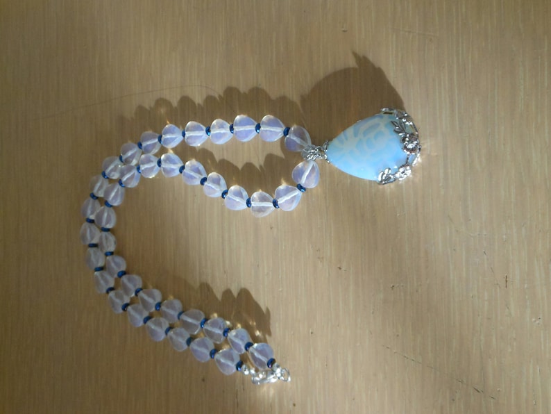Opalite and heart DelightGenuine opalite pendant with floral design bale with opalite faceted heart beads and blue crystal spacerswomens n