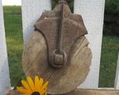 Antique round cast iron wood pulley