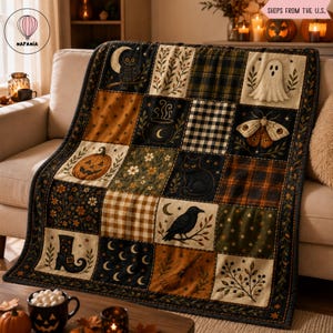 May include: A patchwork throw blanket featuring a grid of Halloween-themed illustrations including a jack-o'-lantern, a black cat, a ghost, a crow, a moth, a witch's boot, a broom, a cauldron, and crescent moons, accented by plaid and floral patterns.