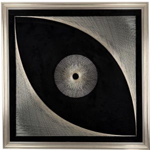 May include: Abstract artwork with a black backdrop, a central circular pattern, and an eye-shaped outline, crafted from white string. The piece is encased in a silver-toned frame, offering a contemporary aesthetic.