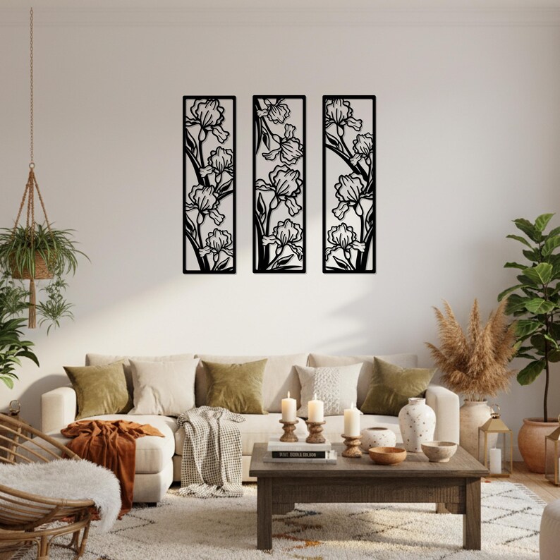 May include: Three black metal wall art panels, each featuring a stylized iris flower design. The panels are rectangular and arranged vertically, creating a cohesive decorative set for a living room or similar space.