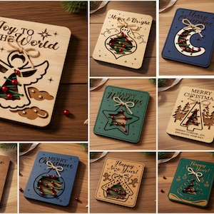 May include: A collection of ten rectangular laser-cut wooden holiday cards featuring various festive designs like angels, stars, trees, and ornaments. Each card includes cutouts, twine bows, and red beads, with text such as Joy to the World and Merry Christmas.