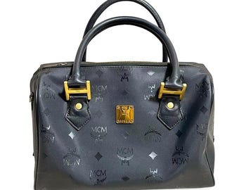 90 年代の本物のブラック MCM ハンドバッグ（エンボスロゴ付き）|高級