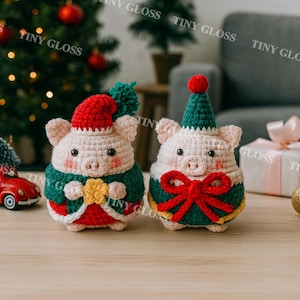 May include: Two crocheted pig ornaments, one with a red Santa hat and the other with a green party hat. Both pigs have green and red outfits with gold accents, ideal for festive decorations.