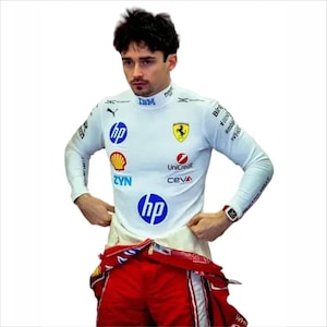 May include: A white long-sleeved racing shirt featuring various sponsor logos including HP, Shell, Ferrari, UniCredit, and Ceva, worn with red racing trousers. The shirt has a high collar with IBM branding and is fitted with long sleeves.