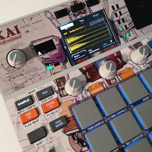 May include: A white and grey MPC professional sampler with a colourful robot design. The sampler features a screen showing a waveform, along with buttons, knobs, and pads. The text "MPC SAMPLE" is visible.