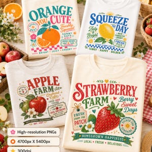 May include: Four folded crewneck sweatshirts featuring colorful graphic prints of fruit and text. The designs include Orange You Cute, Squeeze The Day, Apple Farm, and Strawberry Farm, each with detailed illustrations of oranges, lemons, apples, and strawberries.