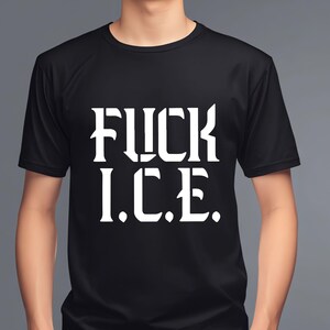 May include: Black crew neck t-shirt with the white text "FUCK I.C.E." printed on the front. The shirt is made of a soft material and is being worn by a person.