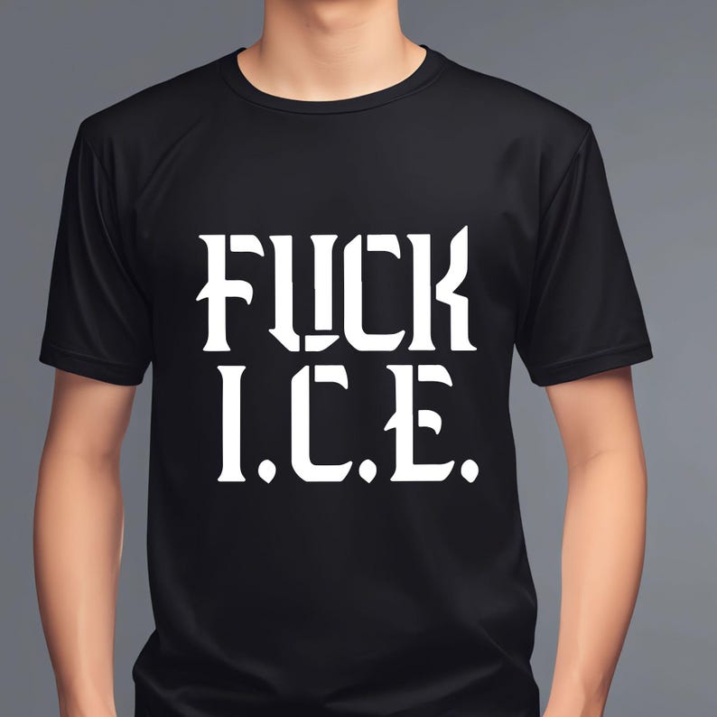 May include: Black crew neck t-shirt with the white text "FUCK I.C.E." printed on the front. The shirt is made of a soft material and is being worn by a person.