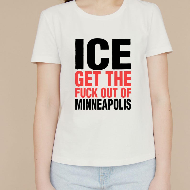 May include: White t-shirt featuring the text "ICE GET THE FUCK OUT OF MINNEAPOLIS" in black and red block letters. The shirt has a crew neck.