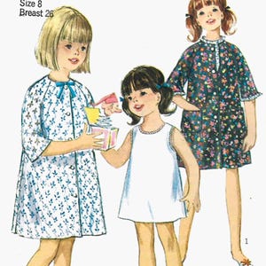 May include: Illustration of three young girls wearing vintage dresses. One girl wears a white dress, another a blue floral dress, and the third a black floral dress. The image includes the text "Girl Size 8 Breast 26".