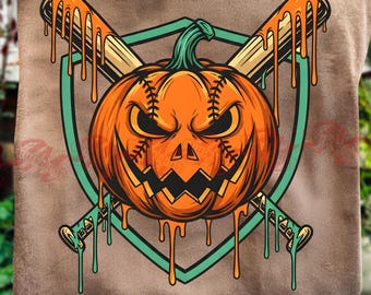 May include: A brown t-shirt featuring a graphic of an orange pumpkin with baseball stitching and a jagged mouth, positioned in front of two crossed baseball bats covered in dripping orange slime, all framed by a teal shield outline.