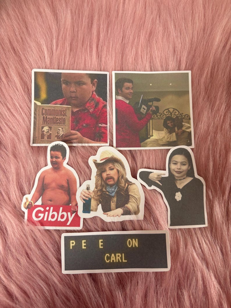 May include: A collection of six stickers featuring various pop culture images and text. One sticker shows a person holding a book titled Communist Manifesto, another shows a person with a camera, and others feature characters with the text Gibby and PEE ON CARL.