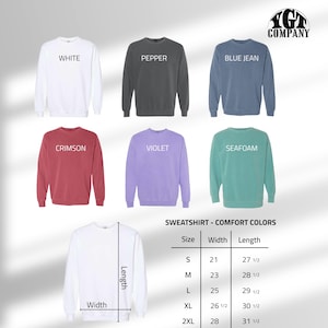 May include: A selection of crewneck sweatshirts in various colors, including white, pepper, blue jean, crimson, violet, and seafoam. The image also displays a size chart with measurements in inches for width and length.