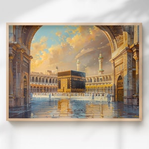 May include: A framed art print depicting the Kaaba in Mecca, Saudi Arabia. The artwork showcases the sacred site with a black cube-shaped structure at the center, surrounded by a courtyard and architectural details. The sky is filled with warm colors.