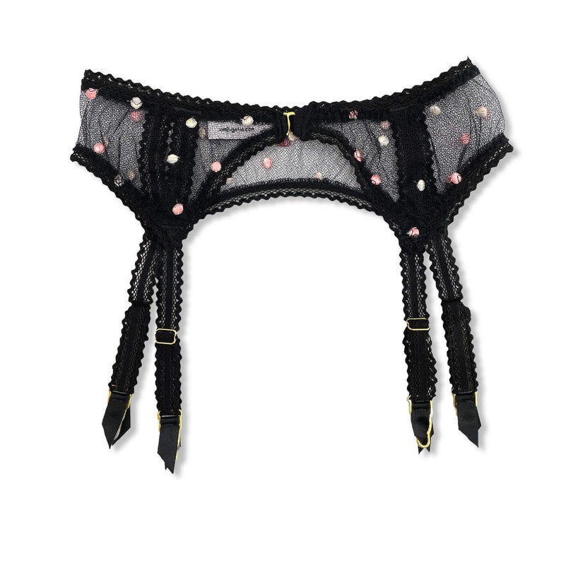 Pastel dot embroidered black French lace suspender belt for wear with traditional stockings. Strappy comfortable elastic in trellis picot style with gold hardware and black satin garter covers, finished with a rainbow tassel in sweet lingerie style.