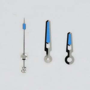 May include: Three watch hands with a silver finish and blue accents. The hands are of different lengths and shapes, including a long, thin hand, and two wider hands. The hands are designed for a watch.