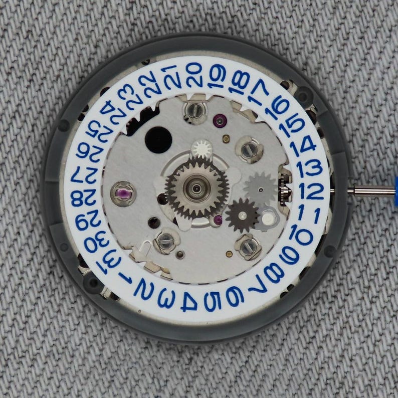 Seiko (TMI) NH34 urverk Vitt med blått datumhjul för klockan 3 bild 1