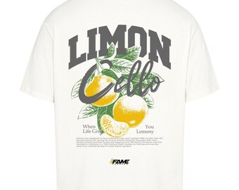 May include: White t-shirt with a graphic of lemons and the text "Limon Cello". The design includes yellow lemons, green leaves, and the words "When Life Gives You Lemony". The shirt also features the word "FAME" at the bottom.