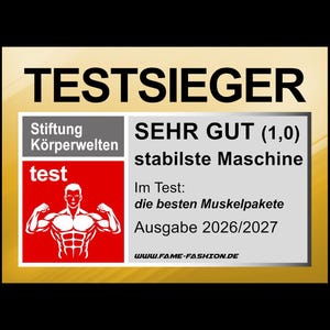Op de afbeelding: Een rechthoekige afbeelding met het woord "TESTSIEGER" bovenaan. Het bevat Duitse tekst, waaronder "SEHR GUT (1,0)" en "stabilste Maschine". Er is ook een rood vierkant met een gespierde figuur.