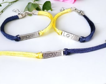 Downs Syndrome Bracelet, blue and yellow satin cord