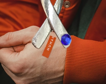 Collar único de concientización sobre la trata de personas: crear conciencia