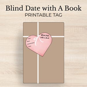 May include: A wrapped parcel with a pink heart-shaped tag. The tag says "Blind Date with a Book" and has prompts for pages, genre, Goodreads rating, and clues. The parcel is tied with white ribbon.