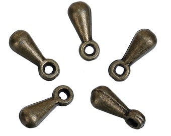 May include: Five antique gold-toned metal teardrop-shaped charms with a loop at the top.