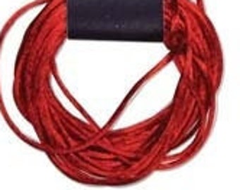May include: A spool of red Rattail satin cord for necklaces and kumihimo braiding. The cord is 2mm in diameter and 6 yards long. The packaging is a wooden-look card with the text "Rattail" and "The Beadsmith".