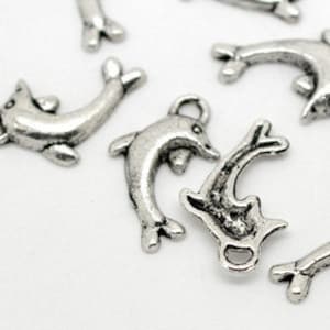10 Silver Tibetan Style Metal DOLPHIN Charm Pendants . 19mm x 11mm   chs0787