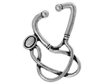 May include: A silver-colored stethoscope charm. The charm is a detailed miniature replica of a medical stethoscope, featuring the earpieces, tubing, and chest piece. The design is intricate, with a vintage or antique aesthetic.