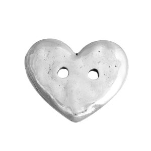 May include: A silver-colored heart-shaped button with two holes. The button has a slightly textured surface and a rounded shape. This decorative button is suitable for sewing and craft projects.