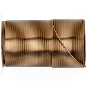 May include: A spool of bronze-colored wire, tightly wound and ready for use. The wire is a warm, metallic tone, and the spool is set against a white background. This wire is suitable for jewelry making, crafts, or other creative projects.