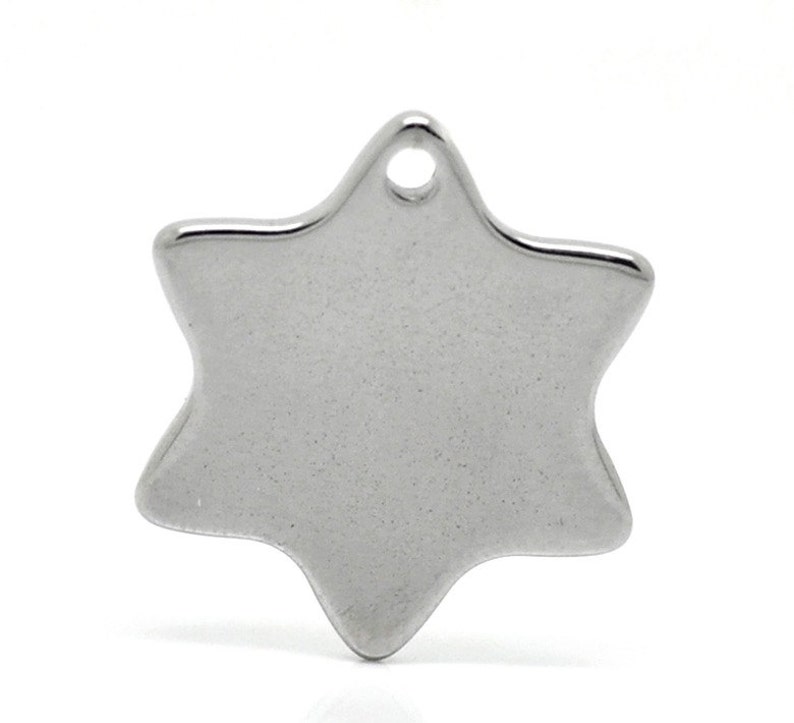 May include: A shiny, silver-colored six-pointed star charm with a small hole at the top for stringing. The charm has a smooth, polished surface and is likely made of metal. This jewelry component is suitable for necklaces, bracelets, or earrings.