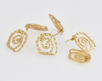 May include: A pair of gold-tone earrings with a spiral design. The earrings are made of metal and have a post back.