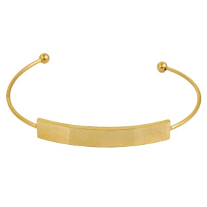 May include: A gold-colored cuff bracelet with a rectangular center plate. The bracelet has a simple, elegant design with rounded ends and a smooth, polished finish. The overall style is minimalist and modern.