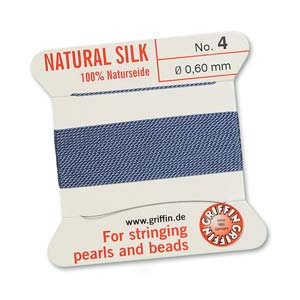 May include: A spool of natural silk thread, labeled "NATURAL SILK" and "No. 4". The thread is a deep blue color, with a diameter of 0.60 mm. The label also includes the text "For stringing pearls and beads" and the website address www.griffin.de.