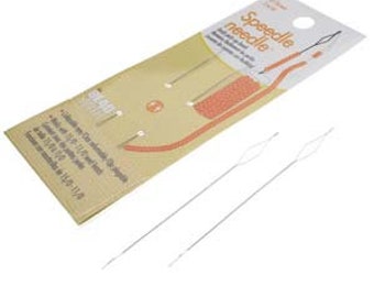 May include: A package of Speedle needles with a beige and orange design. The package includes two silver needles. The text on the package reads "Speedle Needle" and "Beads".