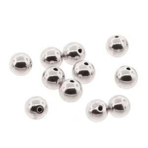 May include: A collection of shiny, silver-colored metal beads. Each bead is spherical with a small hole for stringing. The beads are scattered against a white background, reflecting light.