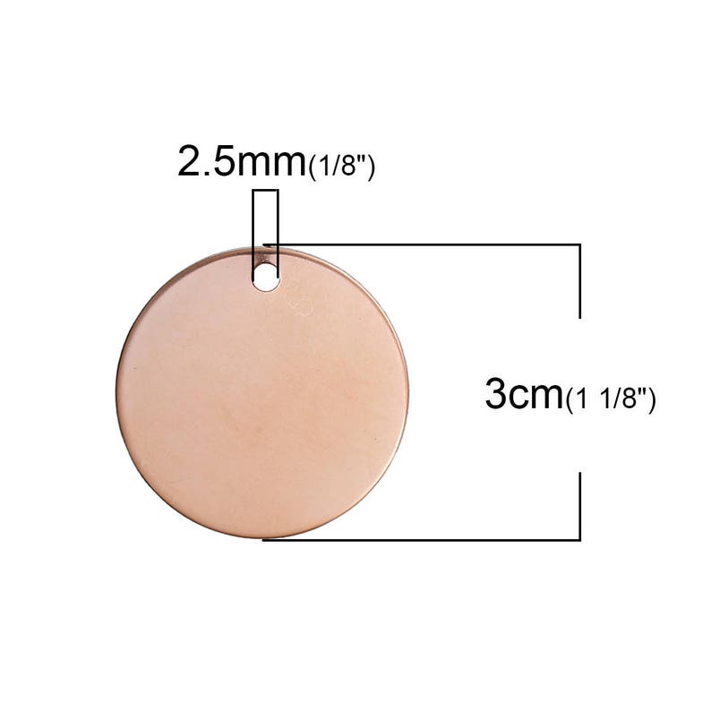 May include: A rose gold-colored, round metal tag with a hole at the top for attaching to a chain or other item. The tag is 3 cm (1 1/8") in diameter and the hole is 2.5mm (1/8").