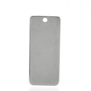May include: A silver rectangular tag with a hole in the top. The tag is smooth and has a slightly textured surface.