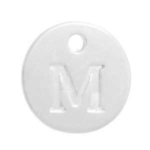 May include: Silver charm with the letter M embossed on a round disc. The charm has a hole at the top for attaching to a bracelet or necklace.