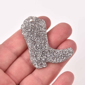 May include: Silver glitter boot charm with a hole at the top for hanging.