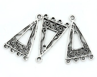 May include: Three antique silver triangle charms with openwork designs. Each charm features a central triangle, decorative swirls, and multiple small loops for attaching to jewelry. The text "Antique Silver" is visible.