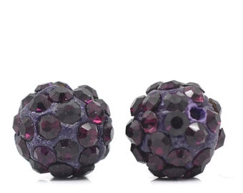May include: Two spherical beads with a dark purple base, encrusted with faceted, dark purple rhinestones. The beads have a textured surface and a hole for stringing. Ideal for jewelry making or craft projects.