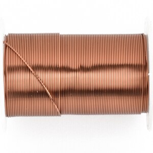 May include: A spool of copper-colored wire, tightly wound and ready for use. The wire is a warm, reddish-brown hue, and the spool has white plastic sides. This wire is suitable for jewelry making, crafting, or electrical projects.