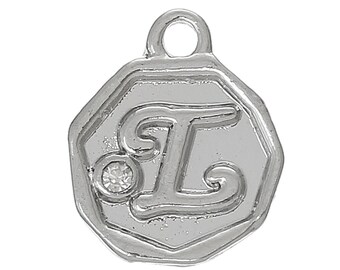 May include: A silver-colored charm with a raised letter "L" and a small, clear gemstone. The charm has an octagonal shape with a loop at the top for attaching to a necklace or bracelet. The charm is likely made of metal.