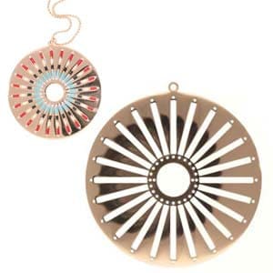 May include: Two circular pendants. One is a gold-colored metal with a sunburst design and a small hole in the center. The other pendant is smaller, with a similar sunburst design in shades of red, blue, and gold, and a delicate chain.